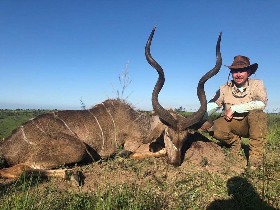 Hunter with a greater kudu bull, Eastern Cape South Africa
